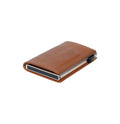 Tony Perotti SLIM Furbo card holder in Honey Brown vegetable-tanned leather, closed and lying flat, with a champagne aluminium case and slider