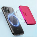 Tony Perotti Furbo EVO MAGSAFE card holder in Fuchsia vegetable-tanned leather, snapping magnetically onto an iPhone