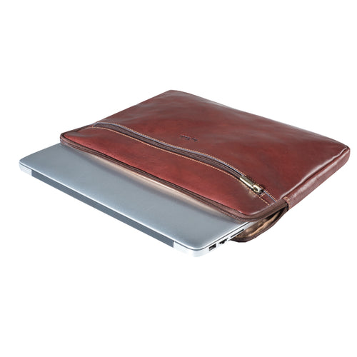 Tony Perotti 13-inch laptop sleeve in Dark Brown leather lying flat, with a laptop partly slid into the zipped opening