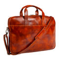 Tony Perotti 1-compartment laptop bag in Van Gogh Cognac vegetable-tanned Tuscan leather, front three-quarter view with shoulder strap