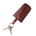 Tony Perotti bell-shaped key pouch in Dark Brown Italian vegetable-tanned leather, keys pulled out on the press-stud strap and ring