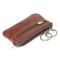 Tony Perotti zipped key pouch with coin pocket in Dark Brown Italian vegetable-tanned leather, at an angle with two key rings attached