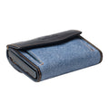 Tony Perotti COIN Furbo card holder in Black & Jeans nappa leather with yellow stitching, closed, showing the coin pocket flap and logo